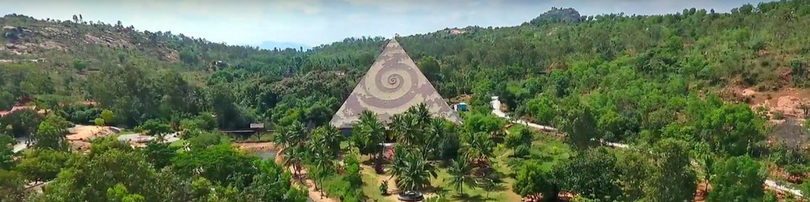 Pyramid Valley Retreat Center - Aerial view of the meditation retreat center with its distinctive pyramid structure surrounded by lush greenery